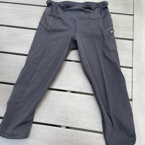 Lululemon cropped black leggings with ruched detailing and zip pockets